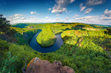 Fresh Green View Of Vltava River Horseshoe Shape Meander From Maj Viewpoint. Amazing Summer Scene Of Mountain Canyon In Czech Republic. Beauty Of Nature Concept Background.