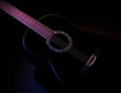 © photo_gonzo - black guitar against split colored dark background. guitar music low-key concept