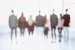 © ASDF - rear view. blurry image of a business team looking out the window