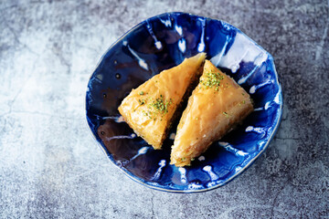 Wall Mural - Turkish delight. Baklava and coconut lukum with cups of coffee