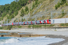 Passenger Train Moves Along Black Sea Coast.