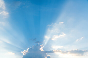 Wall Mural - sunset / sun rise sky with rays of light shining clouds and sky background and texture