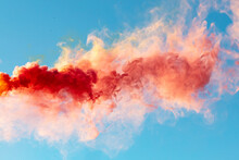 Red Smoke On A Blue Background.