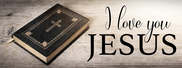 Wall Mural - I love you JESUS - Church faith Christian background banner panorama - Old holy bible with cross on old rustic vintage wooden table with sunshine