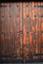 An Old Wooden Door And A Metal Knob