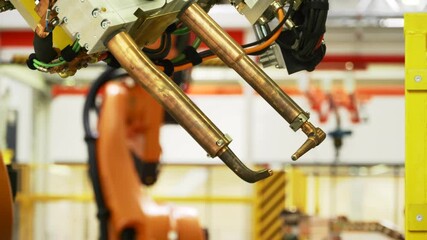 Wall Mural - Latest technology in machine production. Scene. Robotic machines working in production of cars and parts. New technologies and robotization in production