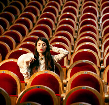 Portrait Of A Pretty Girl Hipster In A Movie Theater Wearing Hat, Dreaming Alone, Fashion Lufestyle People Concept