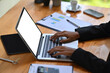 © Prathankarnpap - Close up view businesswoman hands typing on laptop computer.