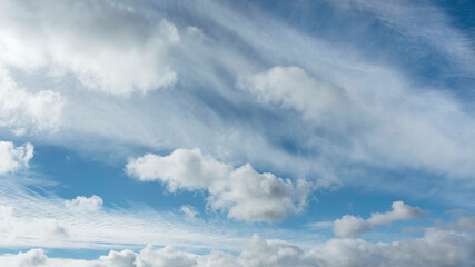 Wall Mural - white clouds and blue sky suitable for background or substitution