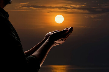 A Muslim man prays to the Lord's blessing at the riverside on a full moon night.