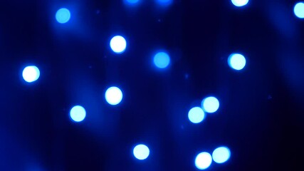 Wall Mural - christmas, holidays and illumination concept - close up of blurred electric garland blue lights in d