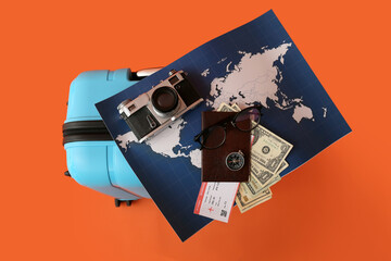 Sticker - Suitcase with travelling belongings and world map on color background