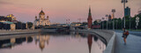 Fototapeta Londyn - Dawn over Moscow and the river, beautiful city landscape. View of the Cathedral of Christ the Savior, Banner format