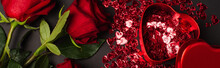 Top View Of Red Roses Near Metallic Heart-shaped Box And Shiny Confetti On Black, Banner.