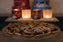 Christmas Cookies With Advent Candles And Cookie Jars In The Background.