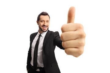 Poster - Happy businessman gesturing a thumb up sign in front of camera