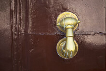Old Iron Door Knob On Aged Brown Door