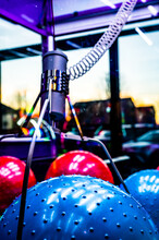 Arcade Claw Grabber Machine With Target Descending On A Toy Ball. Seen Through Smudged Glass