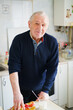 © ADDICTIVE STOCK - Content elderly man in kitchen