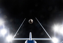 Football Flying Through The Uprights Of The Field Goal Posts During A Night Football Game