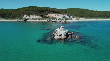 Wall Mural - Aerial view of a beach, turquoise water and huge rocks in the sea. Beautiful seascape.