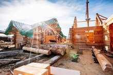 Timber Building House Construction Log With Blue Sky Sun Light