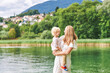© annanahabed - Outdoor portrait of happy young mother with adorable preschooler son, enjoying nice day next to lake