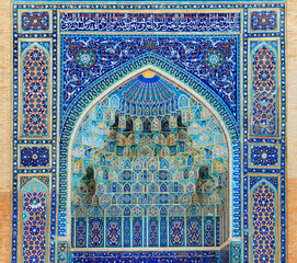 Arch portal with rich floral decoration in Ancient Mausoleum Gur Emir (Amir Timur tomb) in Samarkand, Uzbekistan. It is one of the foremost interesting place in Central Asia