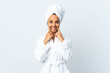 © luismolinero - Young woman in bathrobe over isolated white background smiling with a happy and pleasant expression