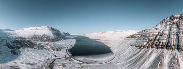 Wall Mural - aerial drone panorama view of westfjords mountains in icealand. blue sky in the westfjords region in