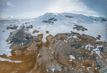 Wall Mural - Aerial Drone view of Hverir in Winter with Snow. Icelandic Hverarond is geothermal area in Myvatn, Iceland. Hverir is a famous tourist destination located near Lake Myvatn, Krafla northeastern region