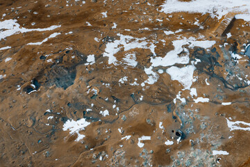 Wall Mural - Aerial Drone view of Hverir in Winter with Snow. Icelandic Hverarond is geothermal area in Myvatn, Iceland. Hverir is a famous tourist destination located near Lake Myvatn, Krafla northeastern region