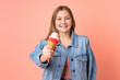 © luismolinero - Teenager Ukrainian girl with a cornet ice cream isolated on pink background with happy expression