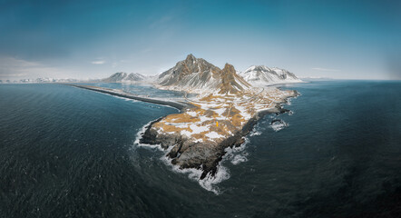Wall Mural - drone view of a snow covered eystrahorn mountain in iceland at hvalnes peninsula