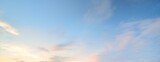 Fototapeta Sypialnia - Clear blue sky with glowing pink and golden clouds after the storm. Dramatic sunset cloudscape. Concept art, meteorology, heaven, hope, peace. Graphic resources, picturesque panoramic scenery