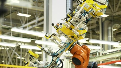 Wall Mural - New technologies and machines in production. Scene. Robotic equipment in production of auto parts. Latest technologies in production of spare parts and machines