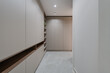 © Artbovich - wardrobe and shelves with decor in the room in a modern style