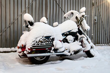 Motorcycle Under The Snow On Winter Parking