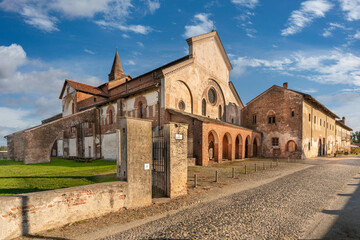 Staffarda di Revello, Saluzzo, Italy - October 8, 2021: Abbey of Santa Maria di Staffarda of Roman Gothic style (XII century), ancient medieval village near Saluzzo