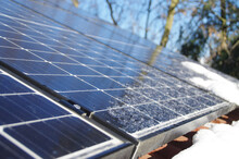 Solar PV Panels Covered By Frozen Ice And Snow During Winter