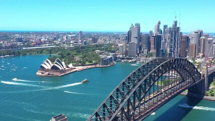 Canvas Print - Aerial drone flyover above Sydney Harbour Bridge on a beautiful sunny day 