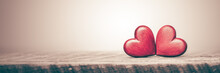 Two Red Hearts On Wooden Table With Soft Background And Vintage Effect - Valentine's Day Concept