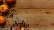 Top Down View Of Natural Wood Surface With Leaves, Pumpkins And Acorns.