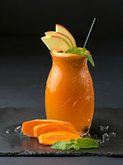 Sticker - Jar of apple - carrot juice and ingredients on a black background