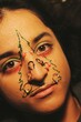 © Alp Peker - closeup portrait of young woman with christmas tree decorations with piercing on face for 2022 new year celebration *2