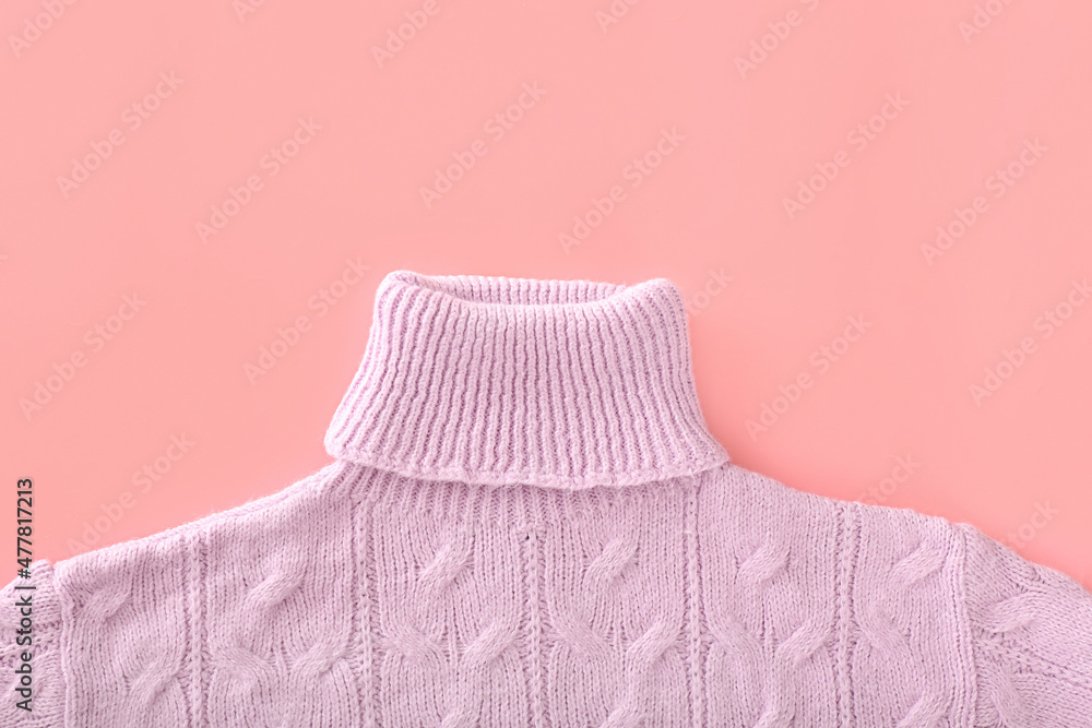 Stylish female roll-neck sweater on color background, closeup
