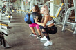 © splitov27 - Two athletic women exercise with medicine balls in the gym. Functional training