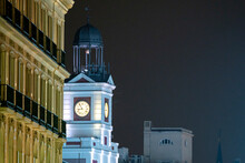 Christmas In Puerta Del Sol, In The City Of Madrid With Lighting And Typical Decoration, The Clock And Christmas Tree