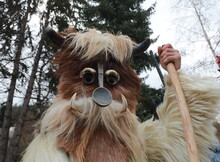 Godech, Bulgaria - January 1, 2022: Mummers In Traditional Costumes Toured The Streets Of Godech On The First Day Of 2022. People With A Mask Called Kukeri Dance And Perform To Scare The Evil Spirits