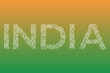 White word India ornamented in oriental style on a green and orange background. Lettering with incredible Indian ethnic ornament